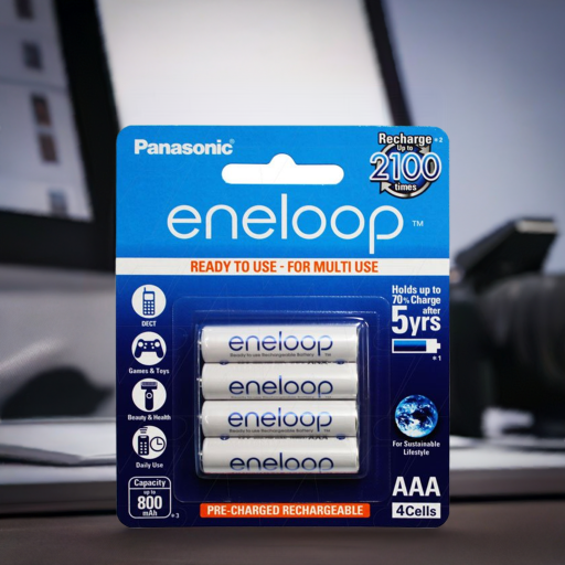 Pack of Panasonic eneloop AAA rechargeable batteries with packaging details on a blurred background